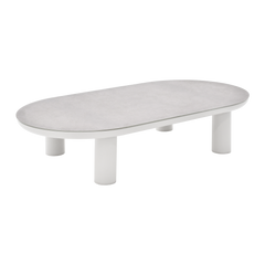 Low oval table has a pale mottled top and several short cylindrical legs