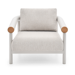 A white upholstered armchair with a squared back cushion, rounded wood arm caps, and white metal frame appears on white