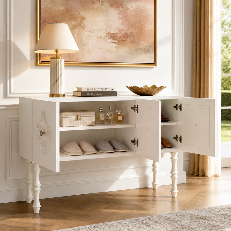 White storage cabinet stands with several doors open, revealing shelves with slippers, boxes, and bottles