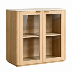 Light wood cabinet with two glass-front doors, gold-colored handles, and an empty shelf behind each door.