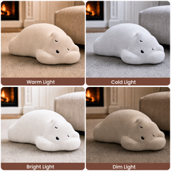 Four panels show a white plush animal-shaped cushion under warm, cold, bright, and dim lighting