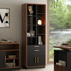 A tall dark wood shelving unit with open cubbies, two drawers, and a lower two-door cabinet stands beside a desk