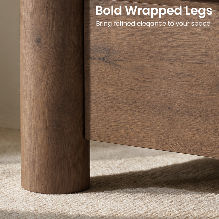 Close-up of a brown cylindrical furniture leg beside a flat panel, both with visible wood-grain patterns, above a cream textured rug.