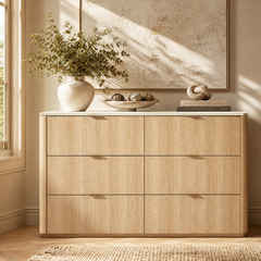Light-toned six-drawer dresser has rounded outer corners and small pulls
