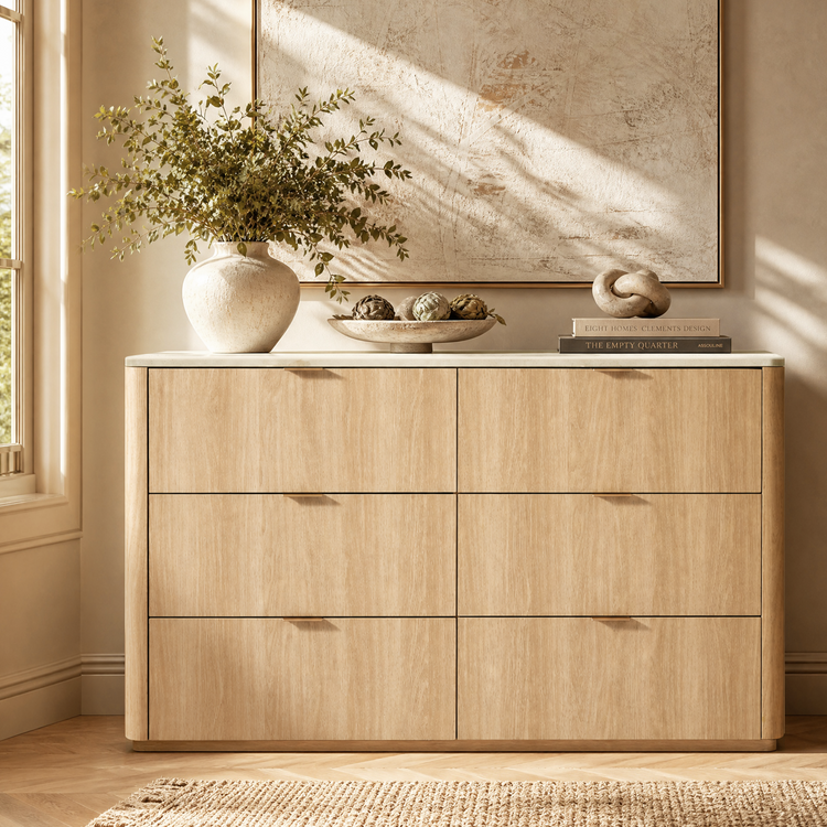 Light-toned six-drawer dresser has rounded outer corners and small pulls