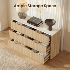 Six partially open dresser drawers reveal divided storage filled with folded clothing