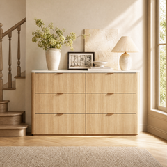 Six-drawer cabinet styled with a lamp, vase, picture, and bowl, Two drawer columns fill the front