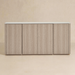 Wide cabinet has four front doors, Pale wood-grain finish surrounds a light slab top