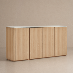 Light wood-grain four-door cabinet with rounded outer corners and a pale slab top