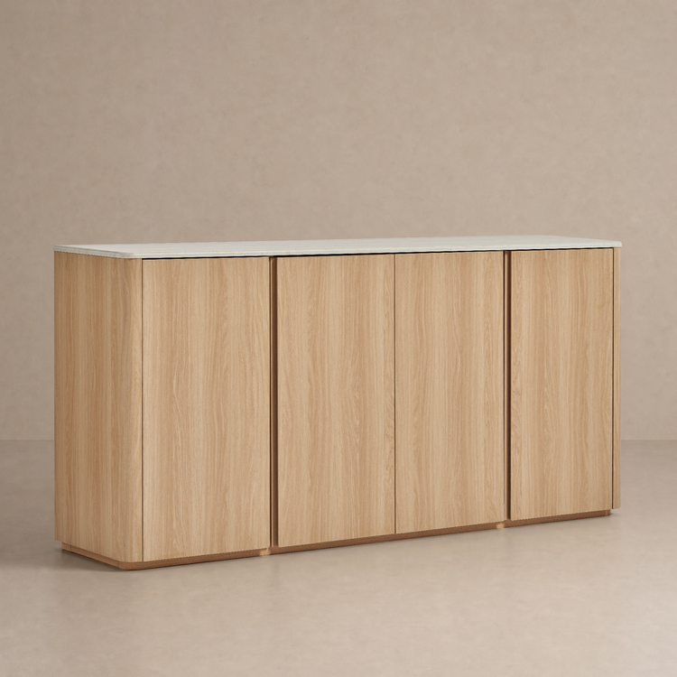 Light wood-grain four-door cabinet with rounded outer corners and a pale slab top