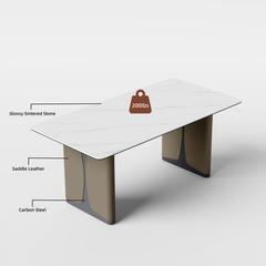 Rectangular dining table has a light veined top and two broad pedestal supports