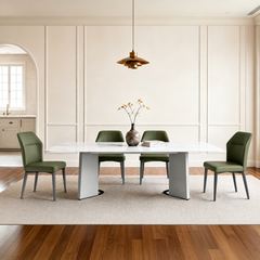 Four visible chairs surround the table, A pendant light hangs above the table