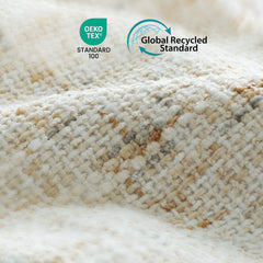Close-up of cream textured fabric with beige and gray flecks, overlaid with OEKO-TEX Standard 100 and Global Recycled Standard logos.