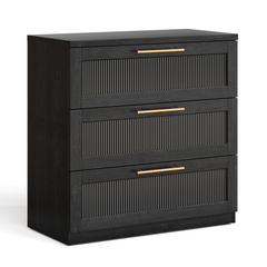 Black three-drawer dresser with ribbed inset fronts and gold-tone bar handles on a white background