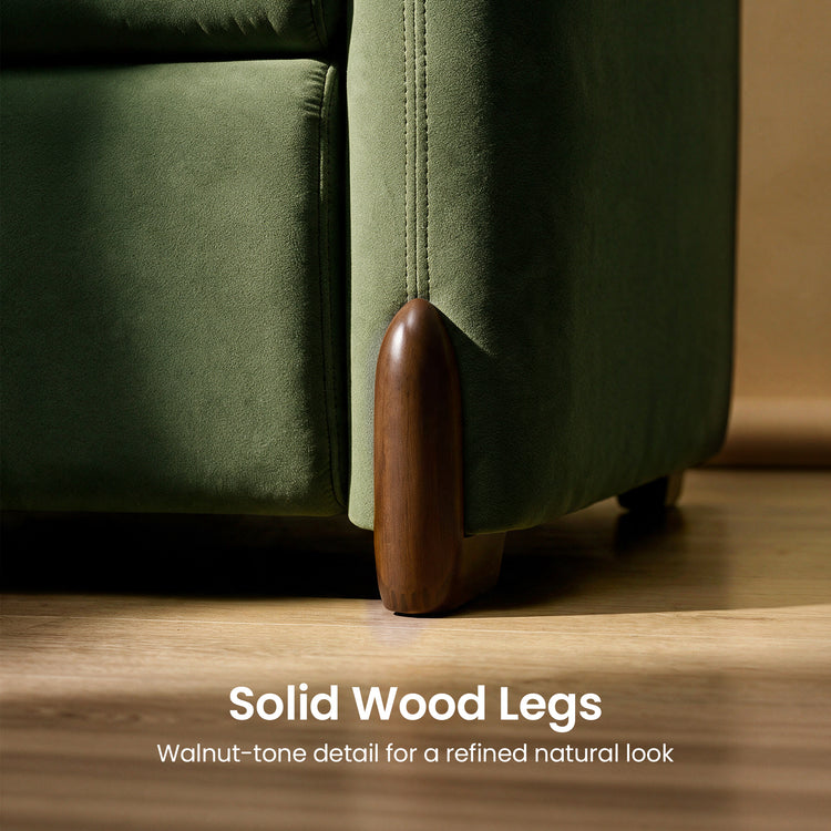 Close-up of green upholstered furniture with a rounded wood leg and text highlighting solid wood legs.