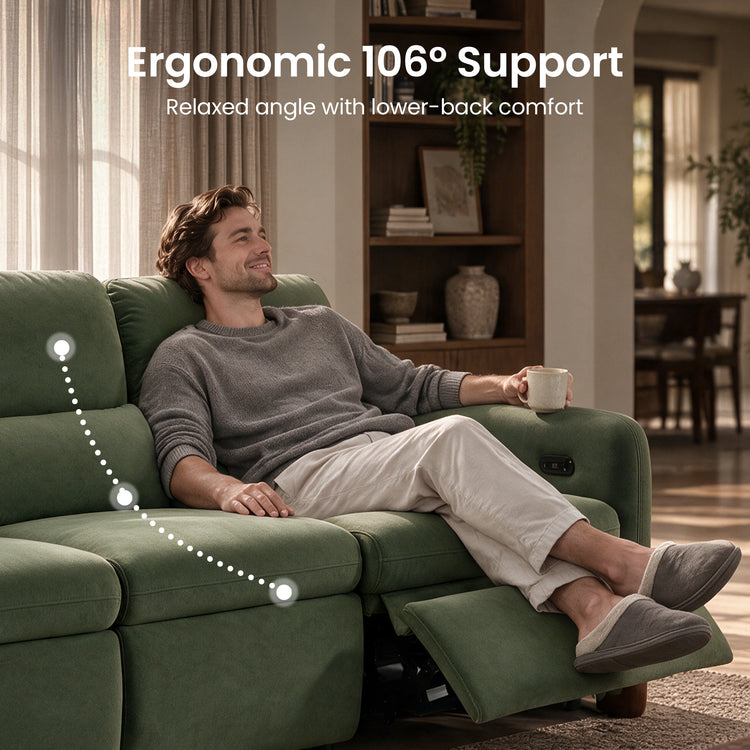 Man relaxing with a mug on a green reclining sofa.
